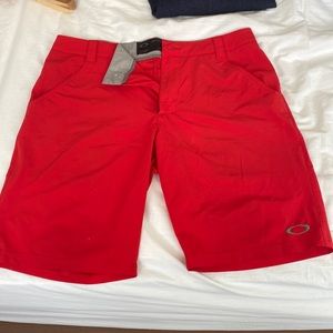 Like new red Oakley golf shorts